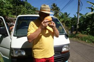 Bill drinking from a fresh coconut