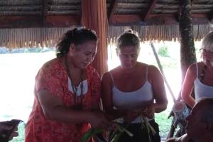 Mama teaching Susan how to make a flower crown