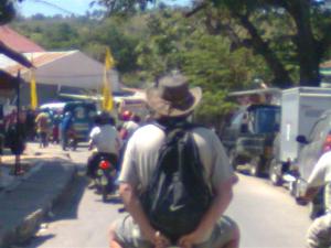 Bill on the back of the motorbike