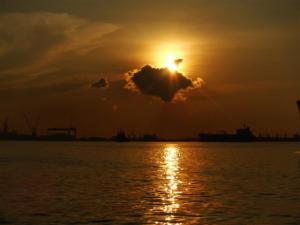 Sun setting over the shipping