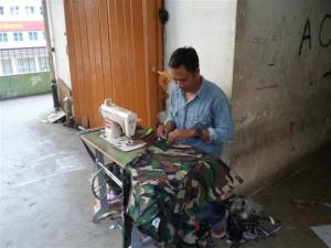 One of many workers sewing