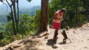 Sue feeding monkeys with beautiful view across the valley