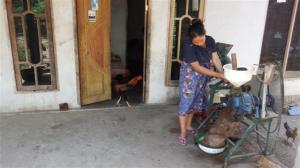 Lady grinding coffee beans