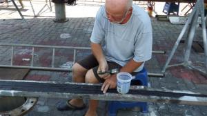 Applying glue to the neoprene strips