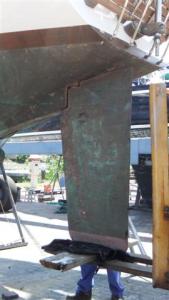 The forklift pushes the rudder right up