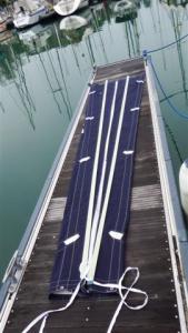 The sail bag laid out on the pontoon